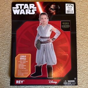 Star Wars Rey costume. Jumpsuit, arm warmers, belt w/ attached bag. Child small.